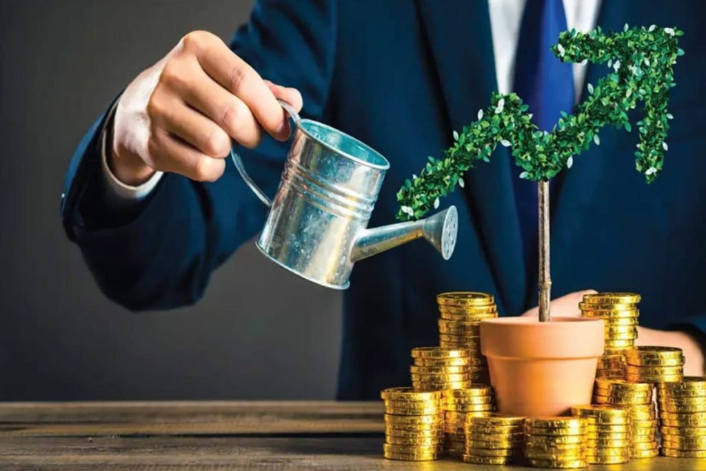Watering a tree with coins around it representing growth of wealth over time. 